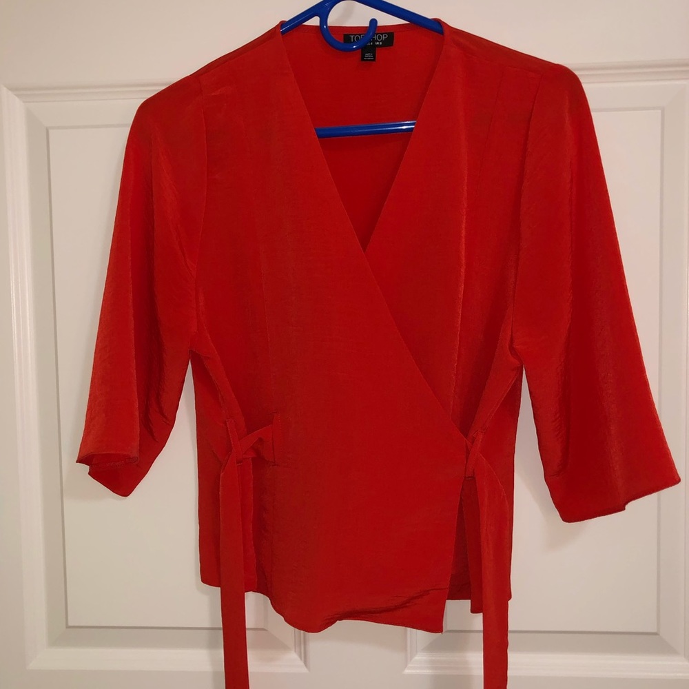 Coral colored wrap blouse